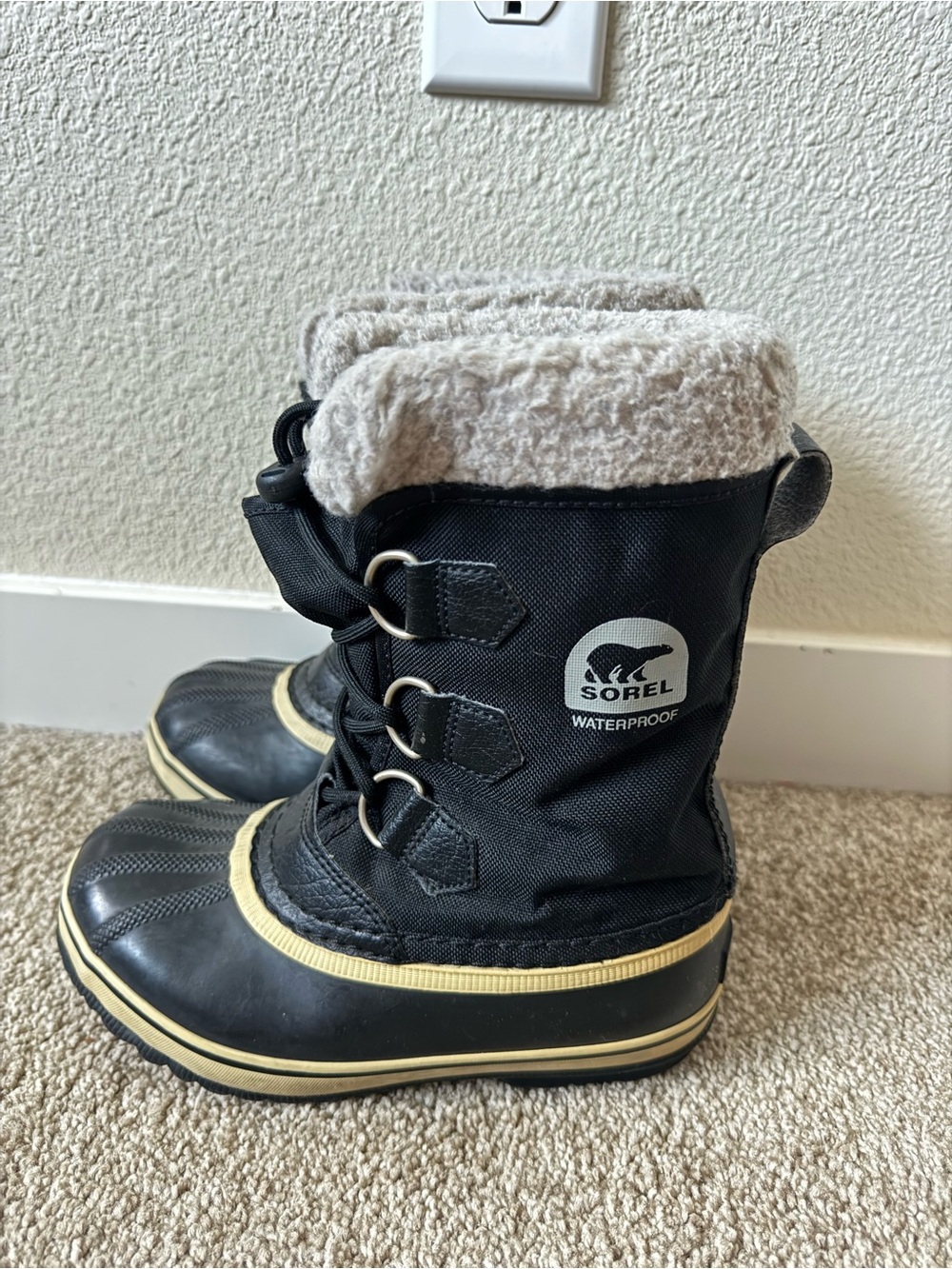 Sorel Kids Black Winter Boots with Cream Fleece Trim